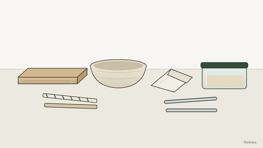 Illustration of takeout items on a table: a plain kraft pizza box, a molded fiber bowl, a folded paper wrapper, two paper straws, two stainless steel straws, and a glass food container with a green lid.